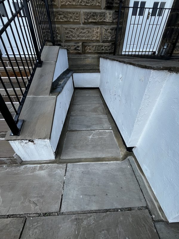Completed paved path repointing and lead flashing reseal at Wells House, Ilkley - tight fresh joints and sealed lead flashings throughout.