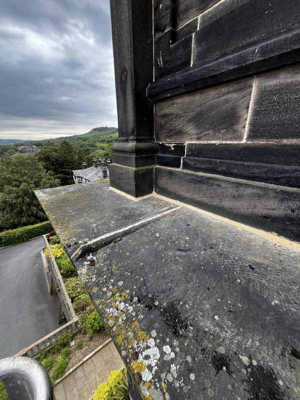 Completed lime mortar repointing on the coping and cornice of Wells House, Ilkley - fresh joints throughout, heritage specification.