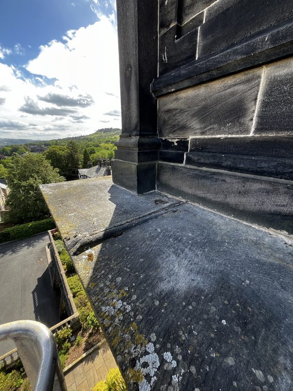 Failed and open mortar joints on the coping of Wells House, Ilkley - before lime repointing works by Northern Seal & Joint.