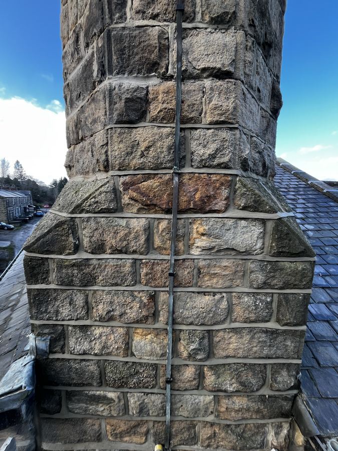 Weatherstruck pointing detail on a converted tannery in Otley - sharp shadow line typical of Yorkshire stonework.