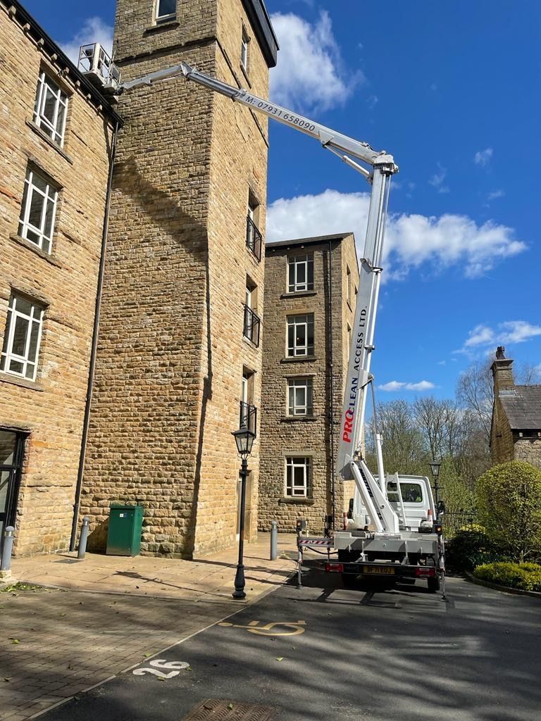 ProClean Access cherry picker at a stone mill building in Yorkshire