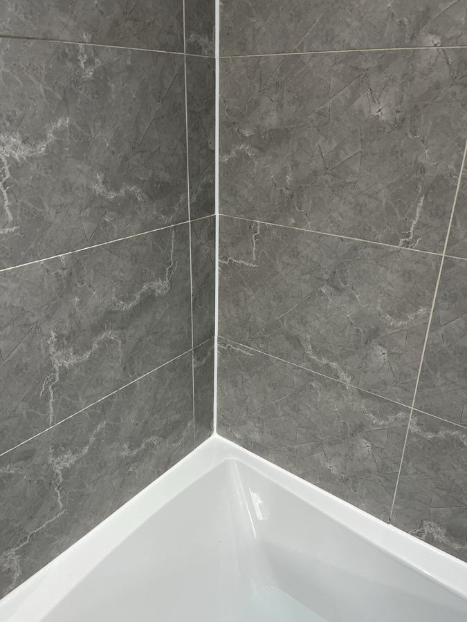 Sanitary sealant replacement in Baildon - failed and mould-affected silicone removed and replaced with mould-resistant sanitary-grade sealant.